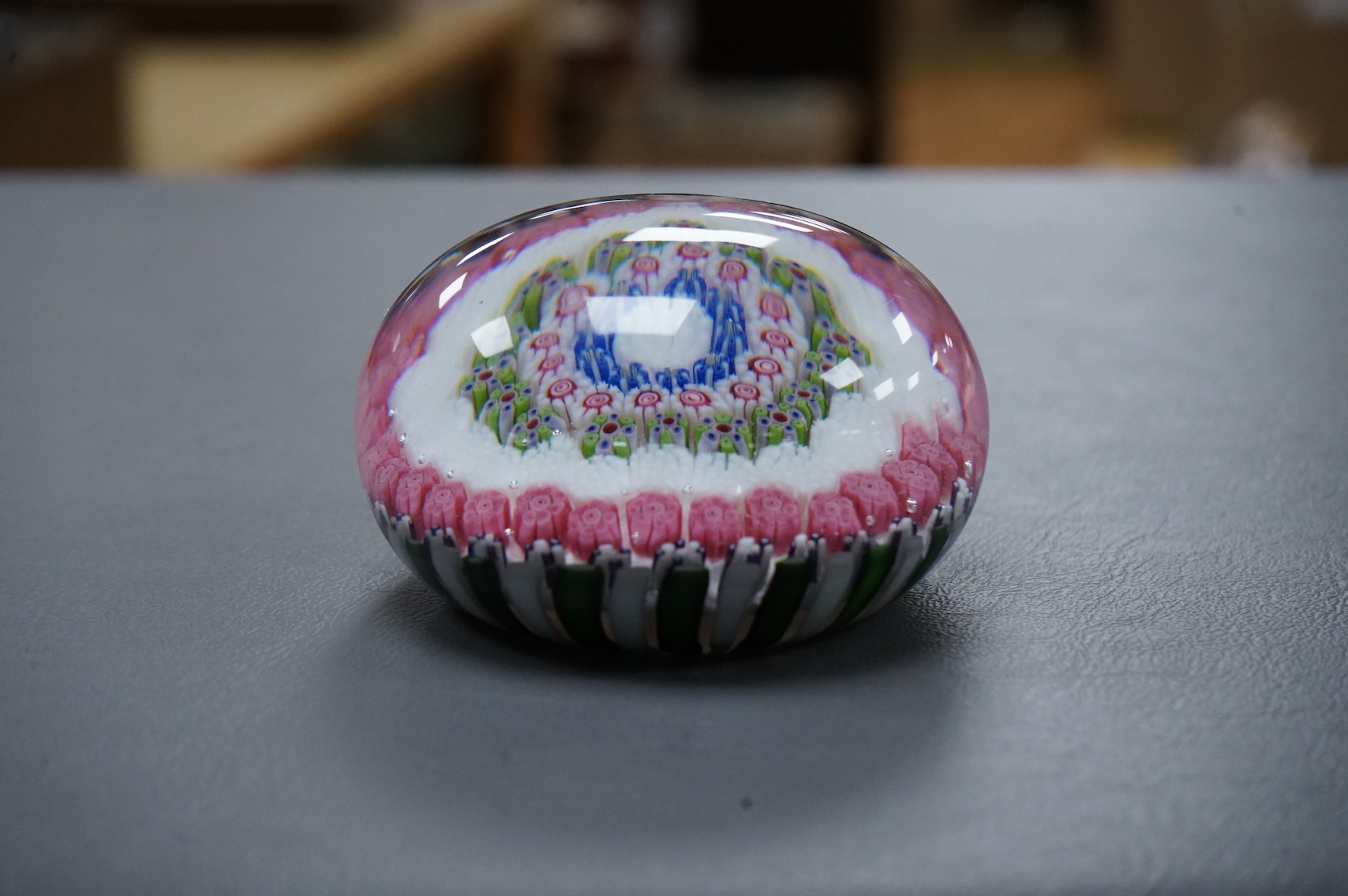 A Clichy concentric millefiori paperweight, green and white - striped basket, 7.5cm wide